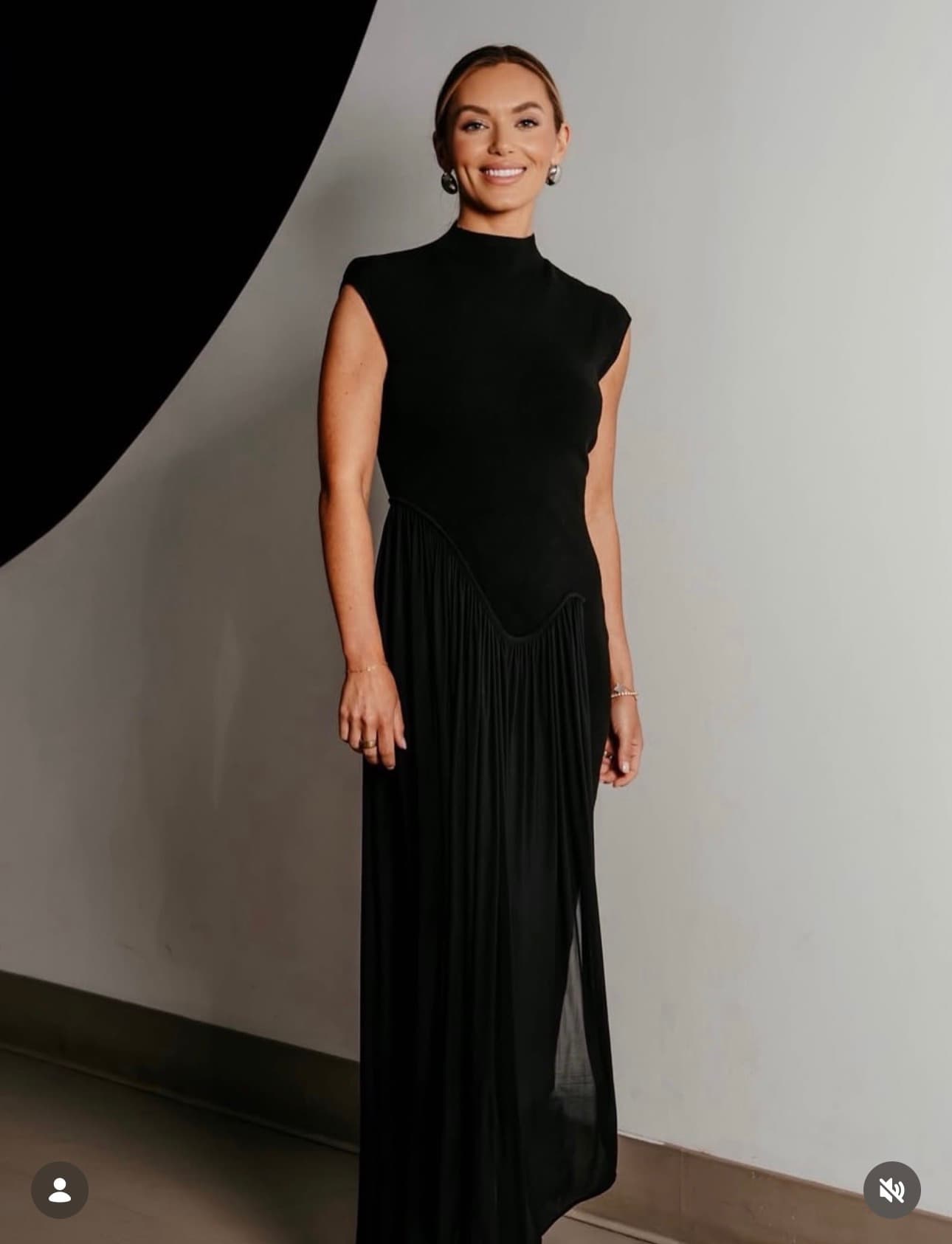 Smiling woman in an elegant black dress