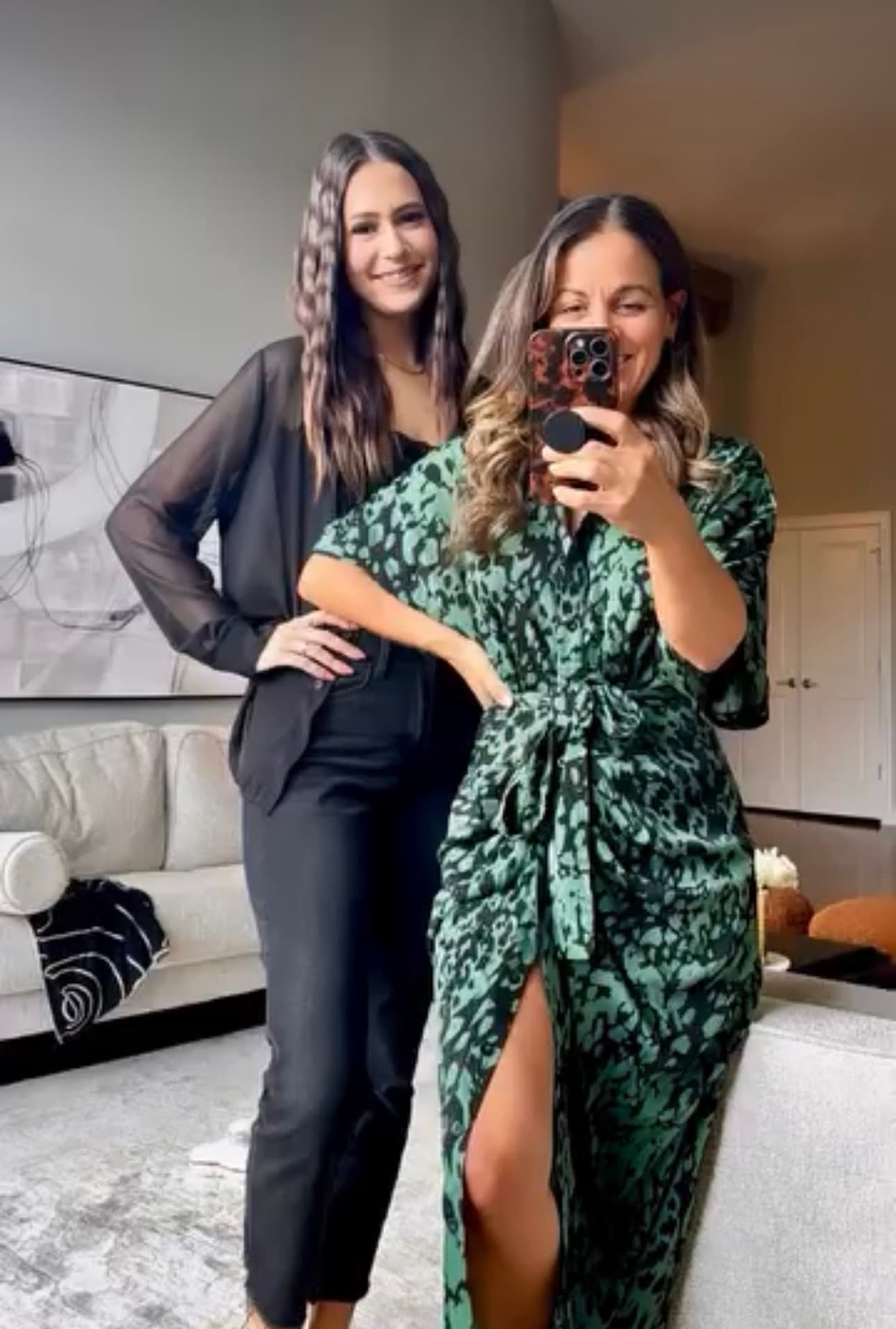 Jenn and a friend smiling for a mirror photo