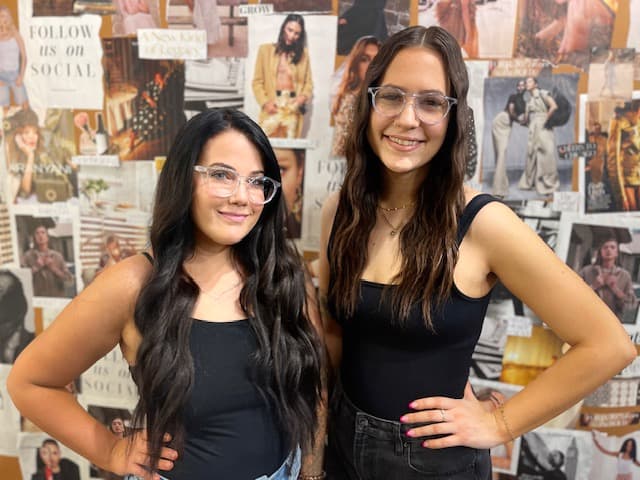 Two Glowout team members wearing clear Spray Specs glasses