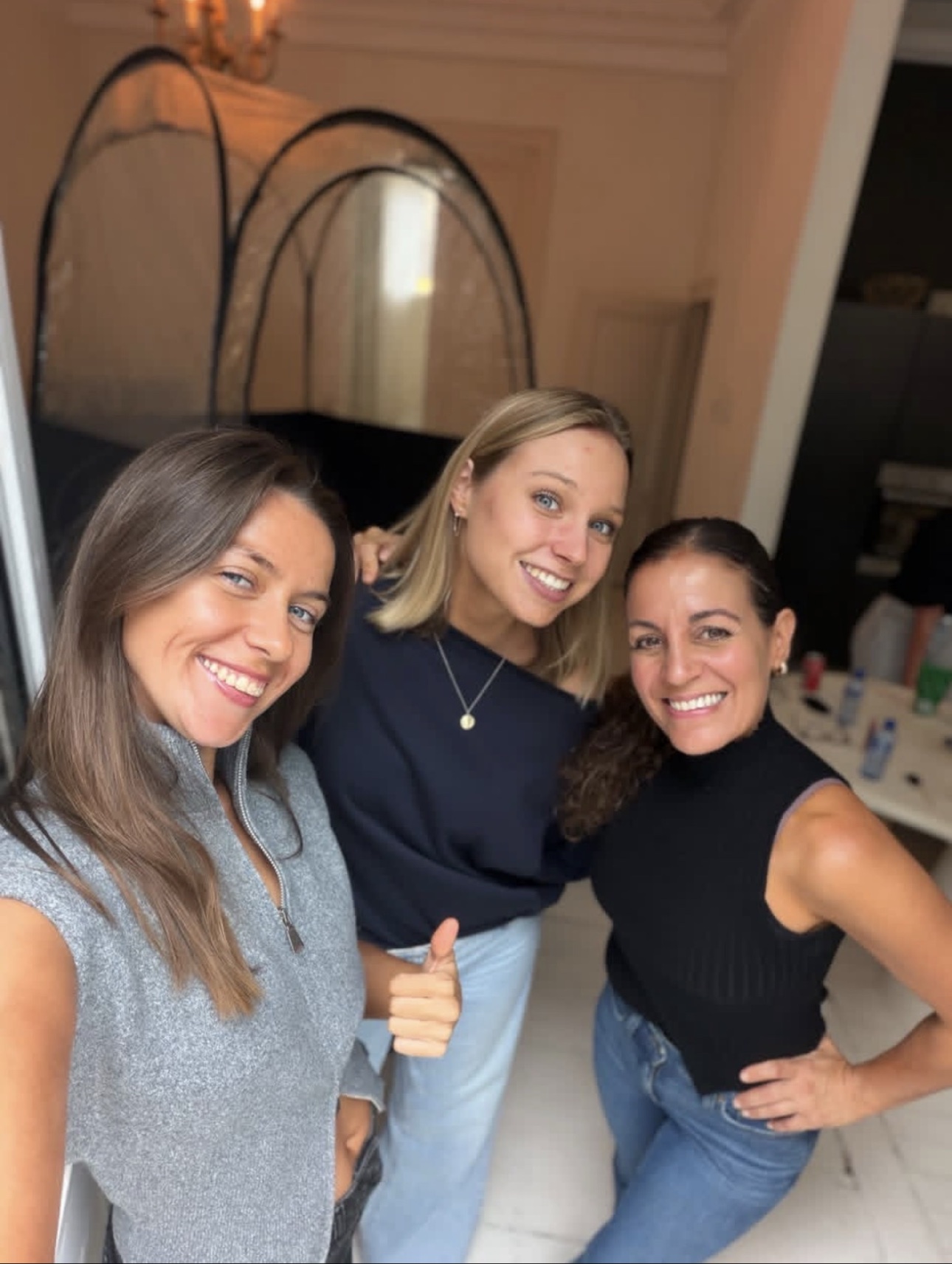 Three women smiling together after a training session